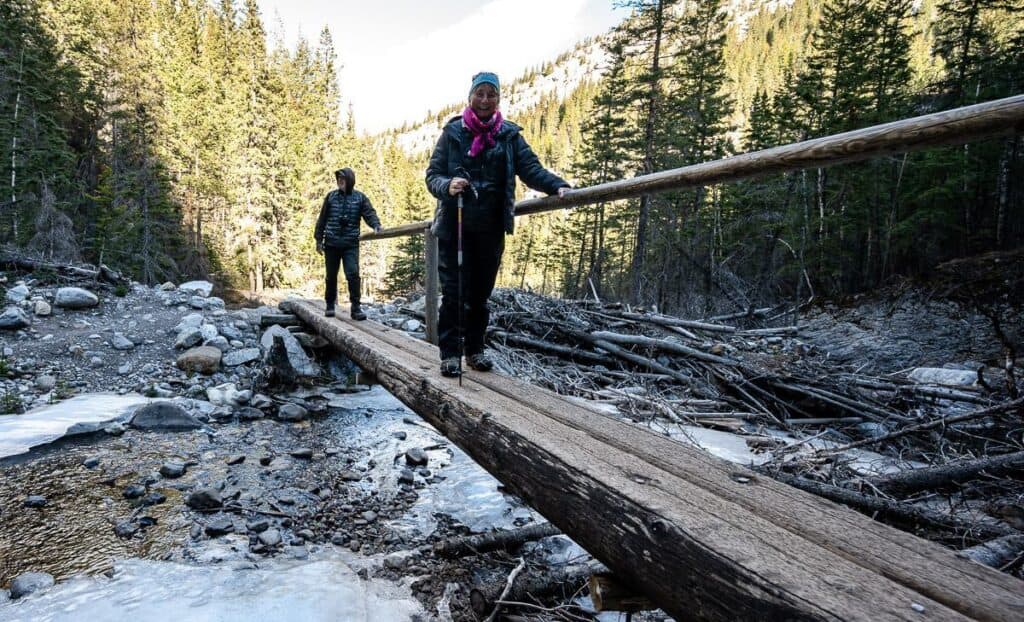 Crossing one of seven bridges over Heart Creek near Canmore