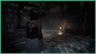 The main character walks through an abandoned house with only a small lantern providing light in Fatal Frame 2 Crimson Butterfly Remake.