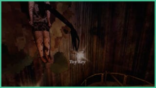 The arm that breaks through the doll on the wall, holding the Toy Key in Dollhouse Bloodshed. The arm that breaks through the doll on the wall, holding the Toy Key in Dollhouse Bloodshed.