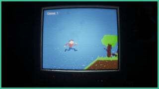 A TV screen with a retro platform game as the room is in complete darkness in REPLAY.