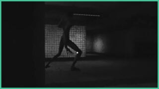 The monster from Unheard Scream walking through the subway in the dark with its long limbs and sharp claws.