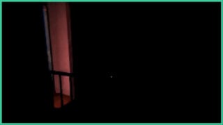 A room in Clap Clap shrouded in darkness, except for the dim light coming from the hallway by the stairs.