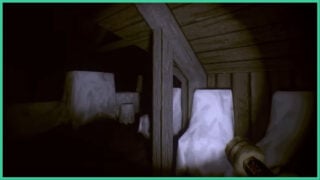 A dark attic space with furniture covered in white sheets, with only the light from the player's flashlight in Somnifuge.