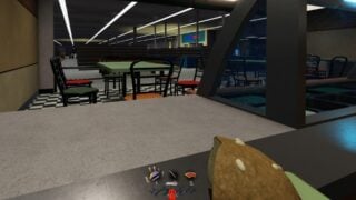 Screenshot from Darkest Hours, showing the POV of a character standing behind the counter in what appears to be a fast food shop. They are holding a burger in one hand. In the background, other players appear to be fighting a robotic monster.