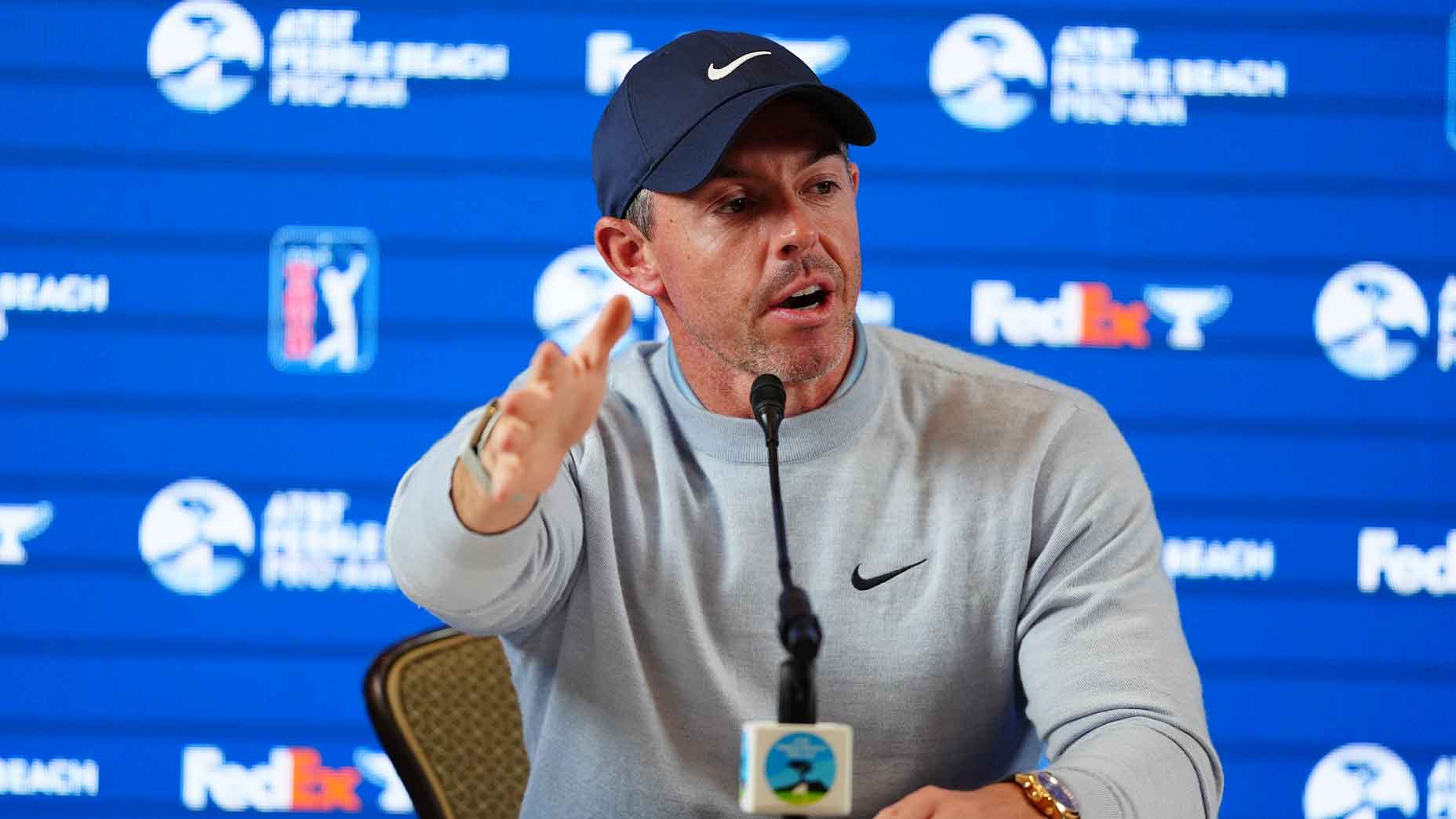 Rory McIlroy speaks at 2026 AT&T Pebble beach pro-am press conference in grey shirt and black hat