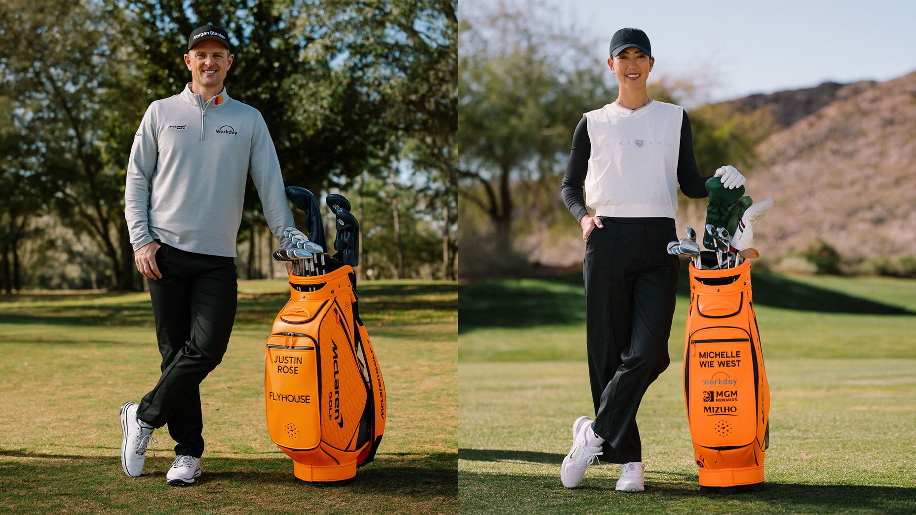 Two golfers stand on a golf course, each next to a bright orange golf bag with their name printed on it. The man on the left wears a gray sweater and black pants; the woman on the right wears a white shirt and black pants.