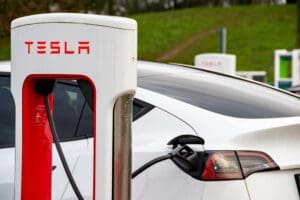 Tesla has almost halved the cost of leasing its electric cars in Britain, in a bid to reverse sliding sales and shore up its market share against fast-growing Chinese competitors.