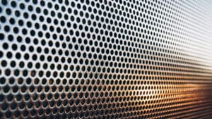 Perforated metal has long been valued for its strength, versatility, and clean visual appeal. Created by punching patterns of holes into metal sheets, it offers a practical balance between airflow, light control, and structural support.