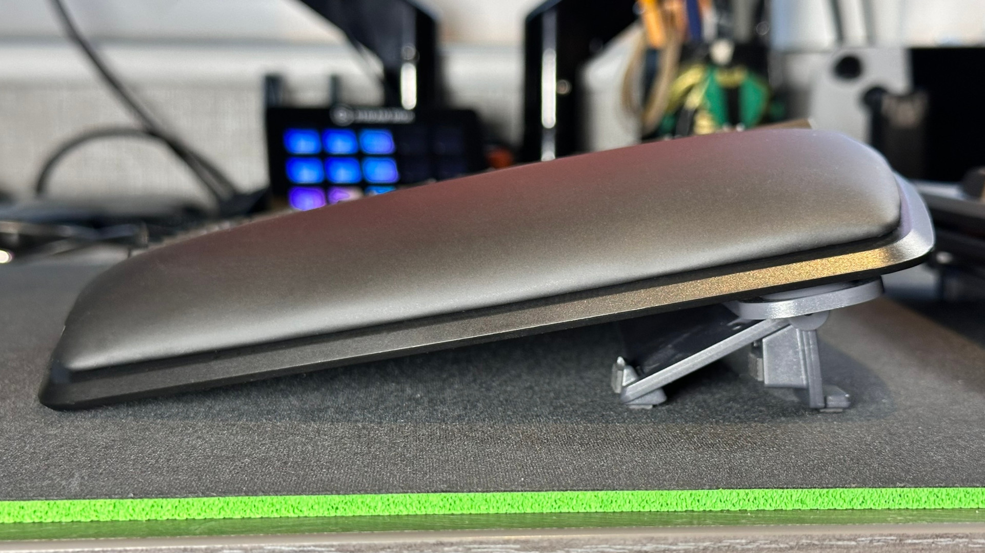 A side view photograph of the Kinesis Gaming Freestyle Edge RGB Plus ergonomic keyboard, showing the lift kit set to 10 degrees