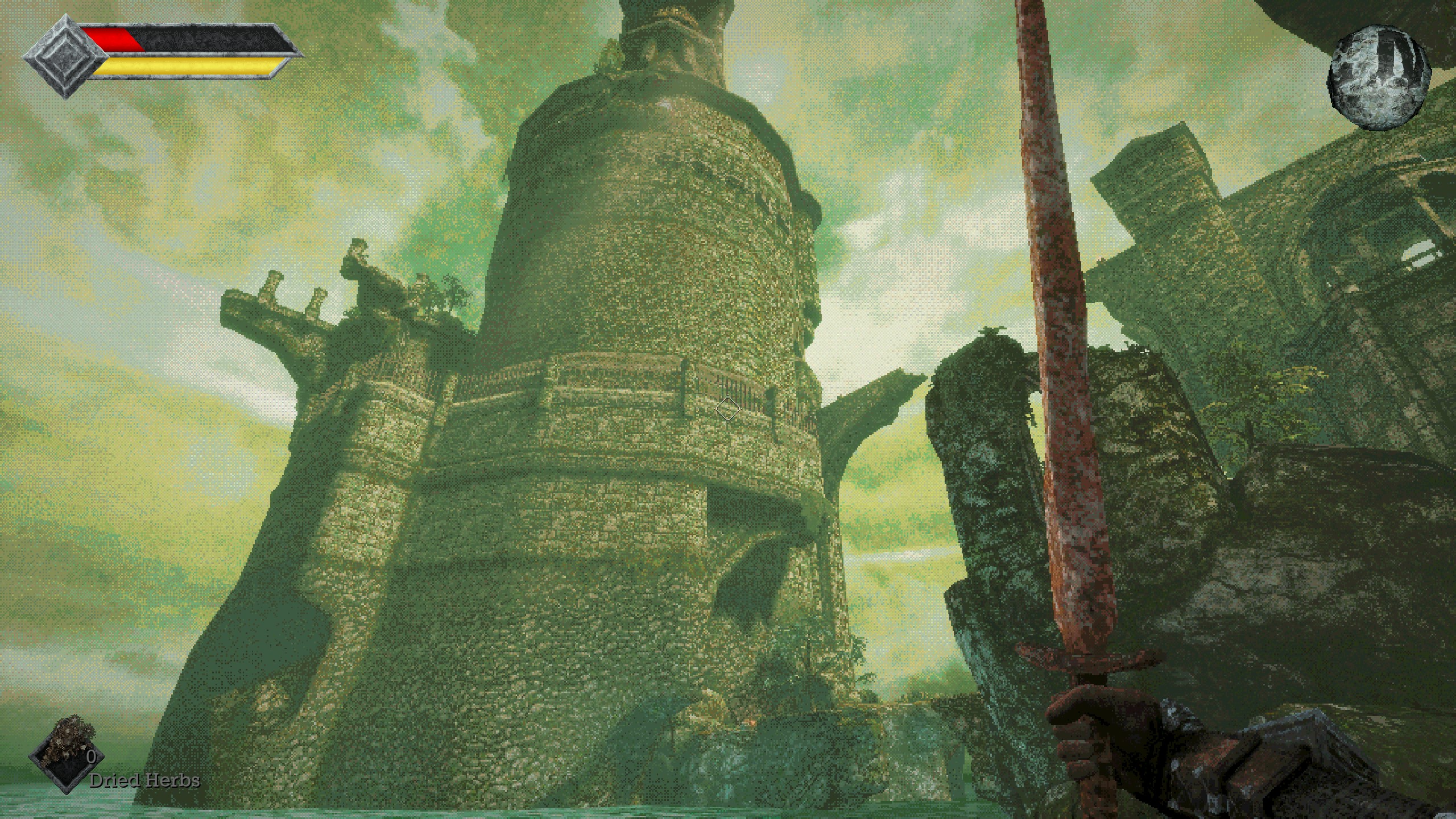 Looking up at stone tower rising out of the sea in Queen's Domain