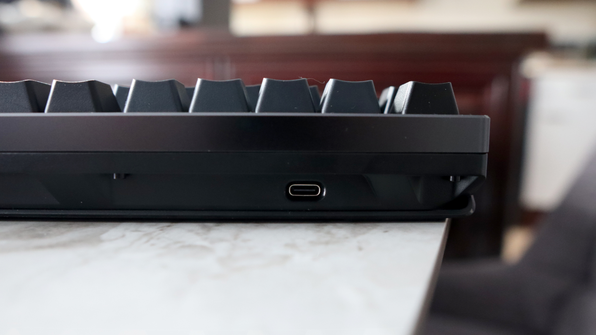 Asus ROG Azoth 96 HE on a desk.