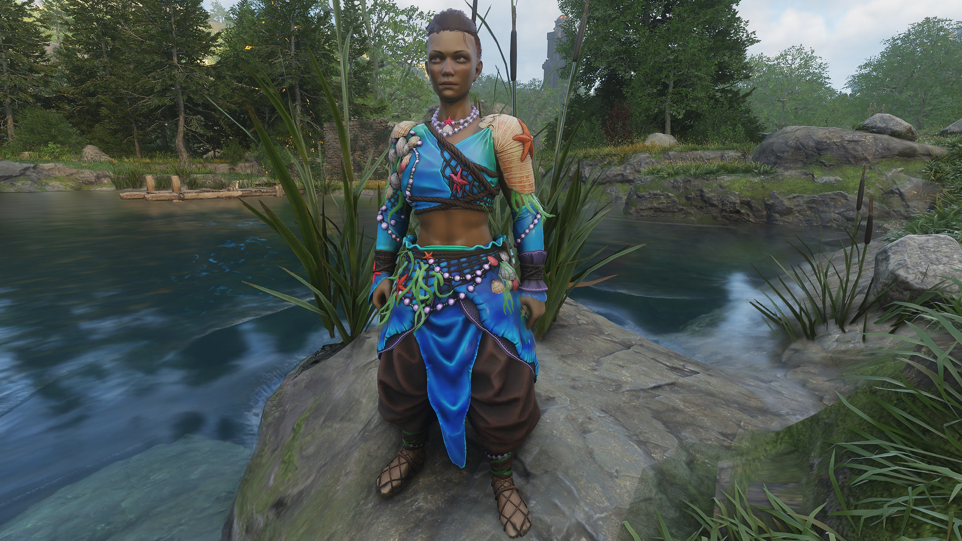 Enshrouded - Character wearing the blue and beaded vanity set from Twitch Drops, the Siren Seeker gear