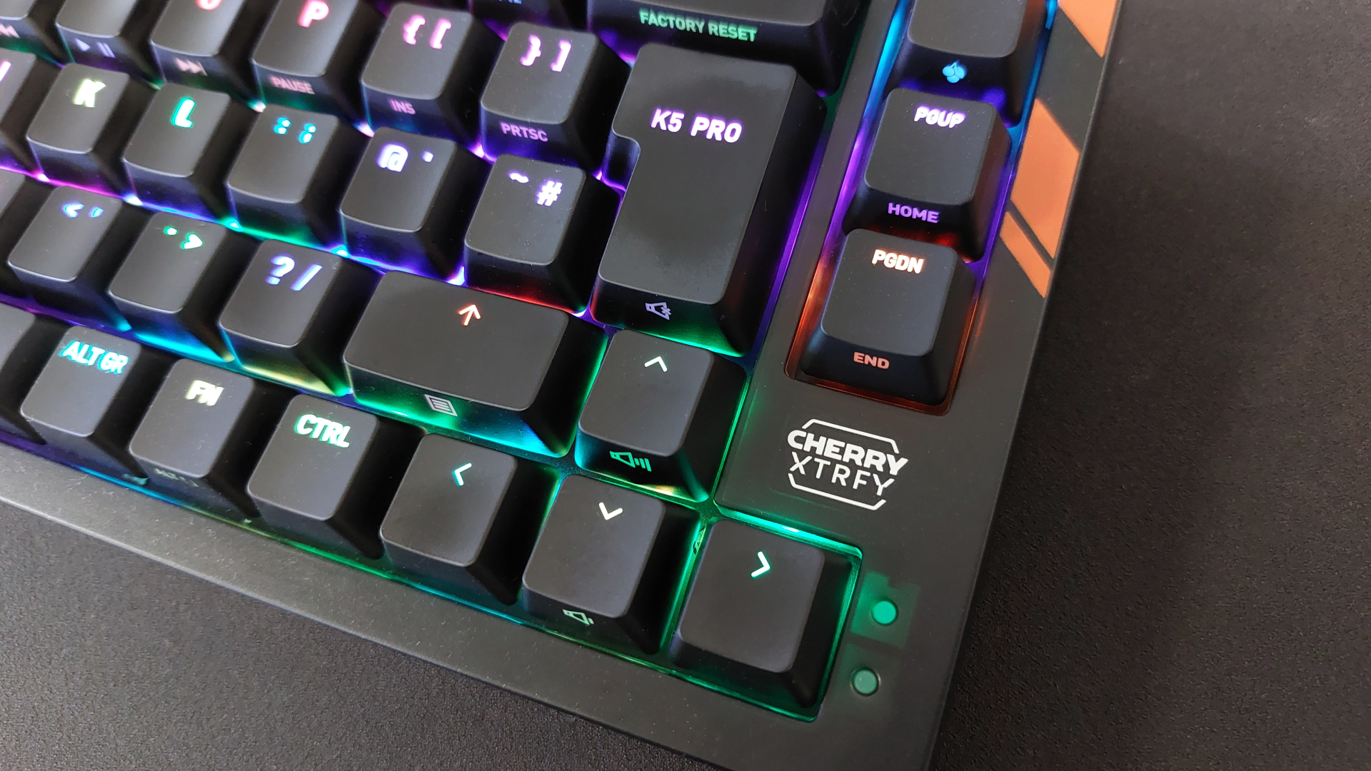 The Cherry K5 Pro TMR Compact on a black mousepad with the RGB lights on.