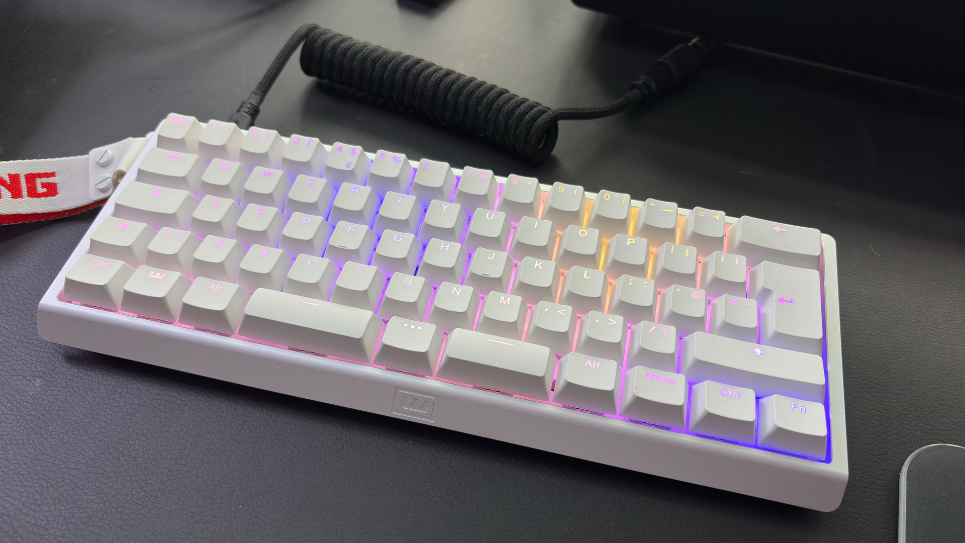 The Wooting 60HE v2 with a split spacebar on a desk alongside the Wooting 80HE with a normal spacebar.