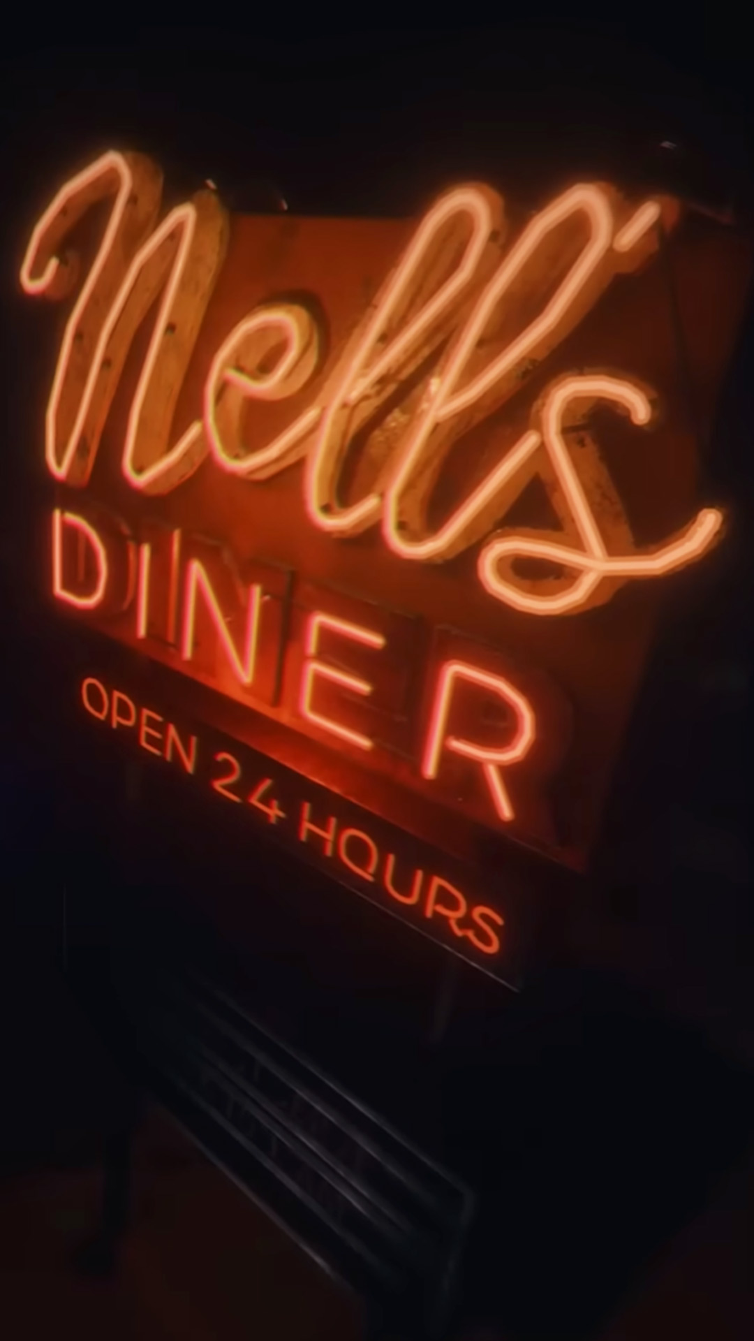 The Nell's Diner neon sign logo with 
