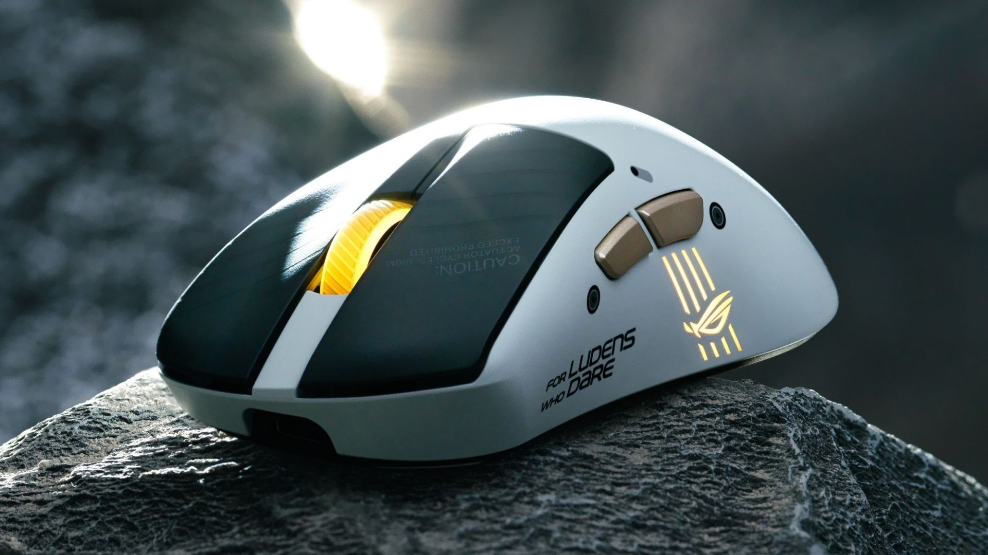 Asus x Kojima Productions gaming mouse  on a rock
