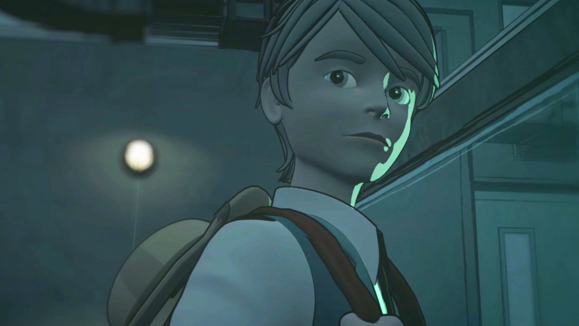 A young man looking at something in a mansion