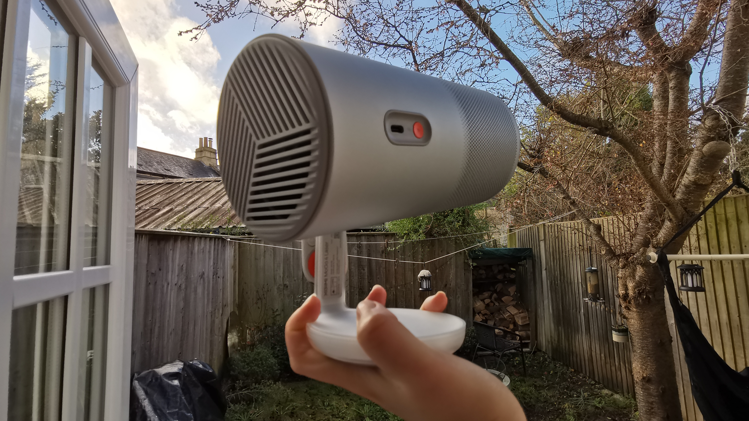 The XGIMI MoGo 4 Laser projector set-up with various accessories.