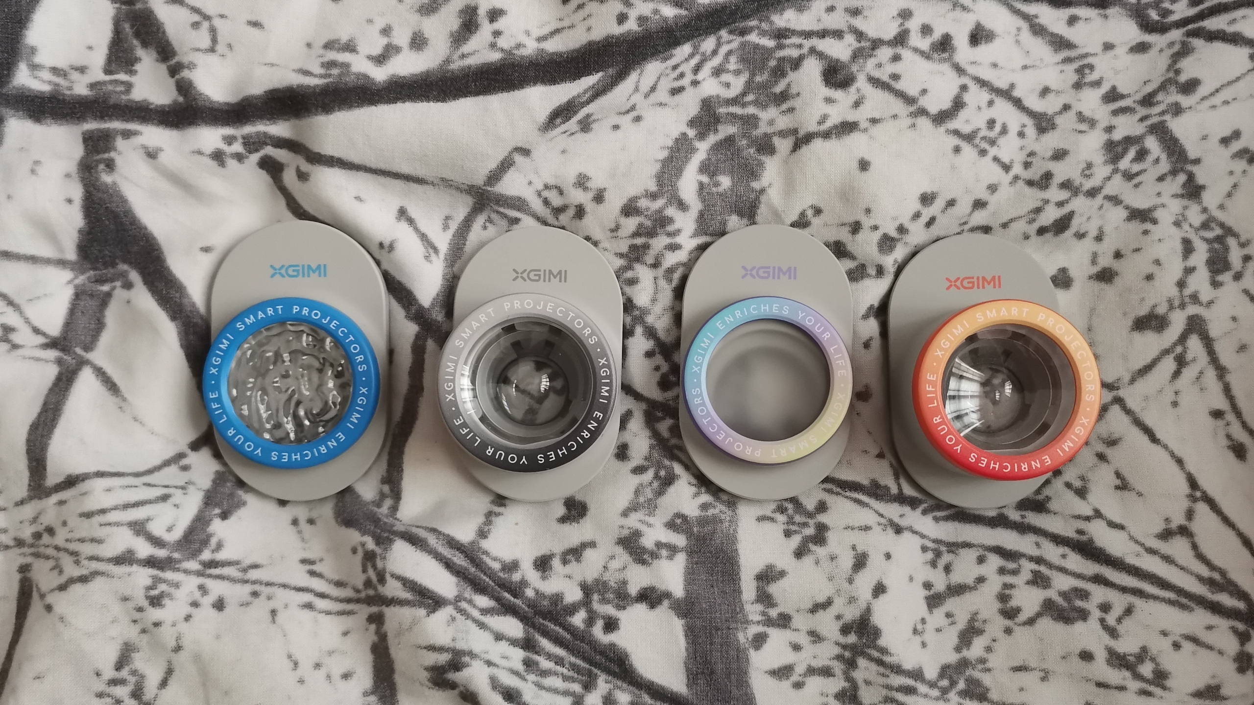 The XGIMI MoGo 4 Laser projector set-up with various accessories.