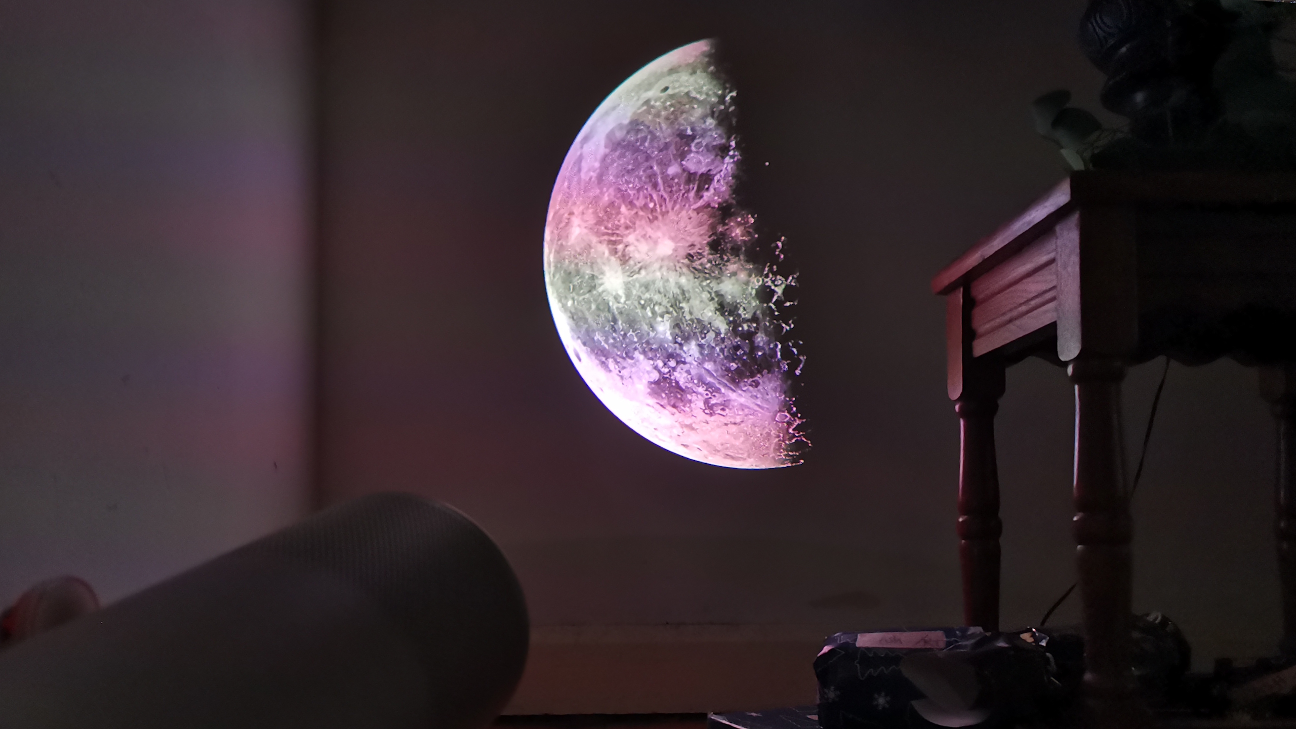 The XGIMI MoGo 4 Laser projector set-up with various accessories.