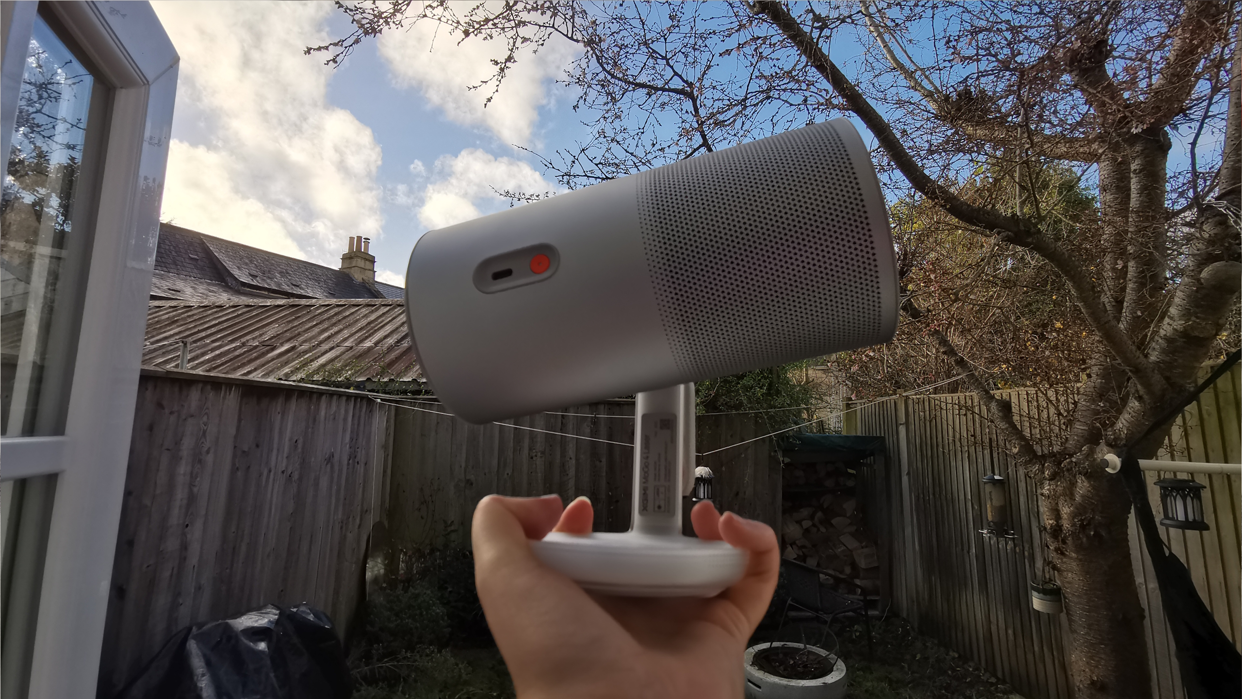 The XGIMI MoGo 4 Laser projector set-up with various accessories.