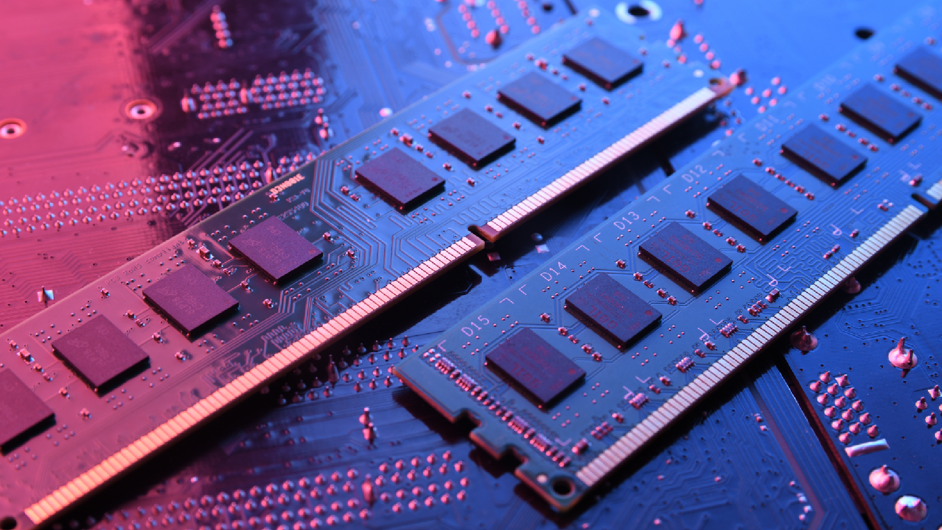 A dramatically lit close up of computer memory/ RAM on a motherboard-style background.
