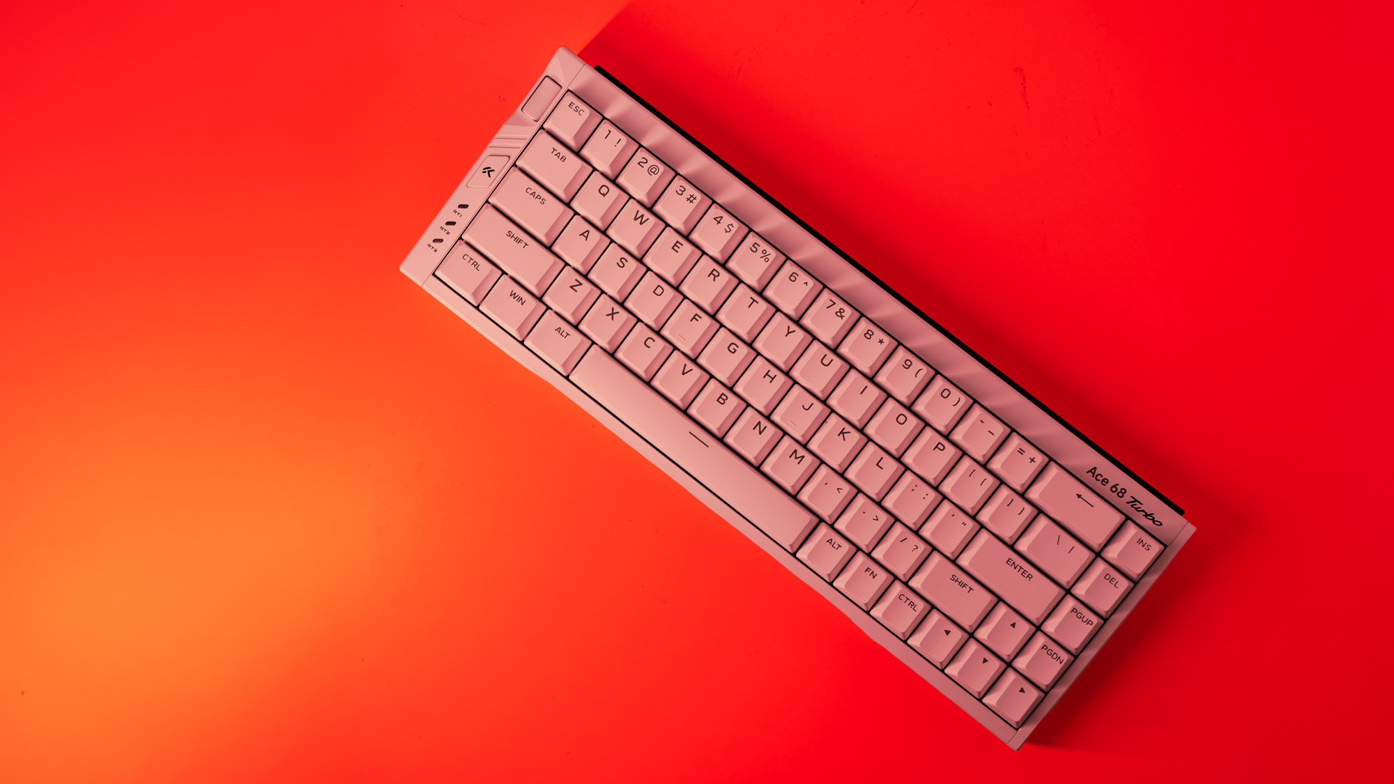 The Mchose Ace 68 Turbo on a red background.