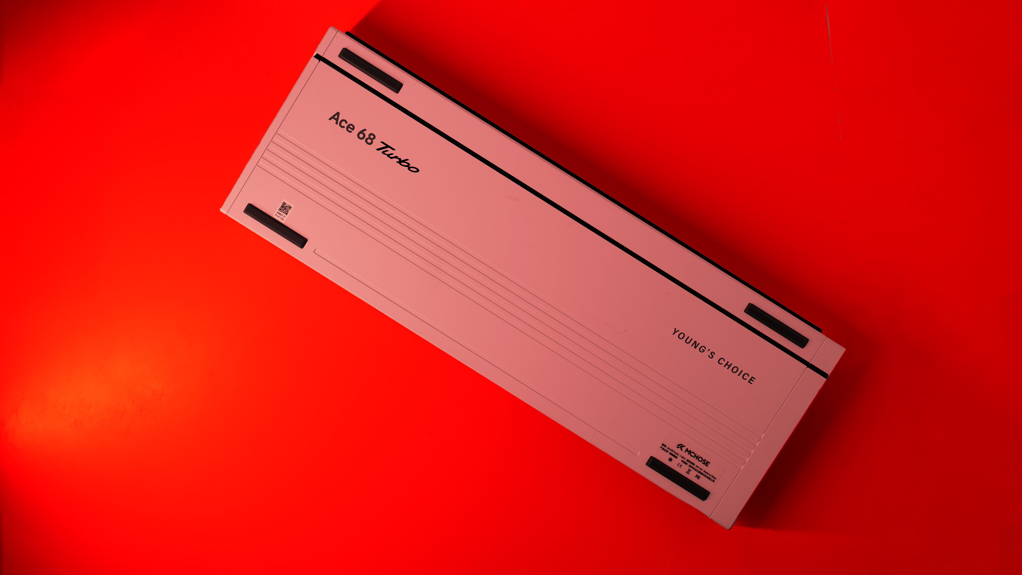 The Mchose Ace 68 Turbo on a red background.