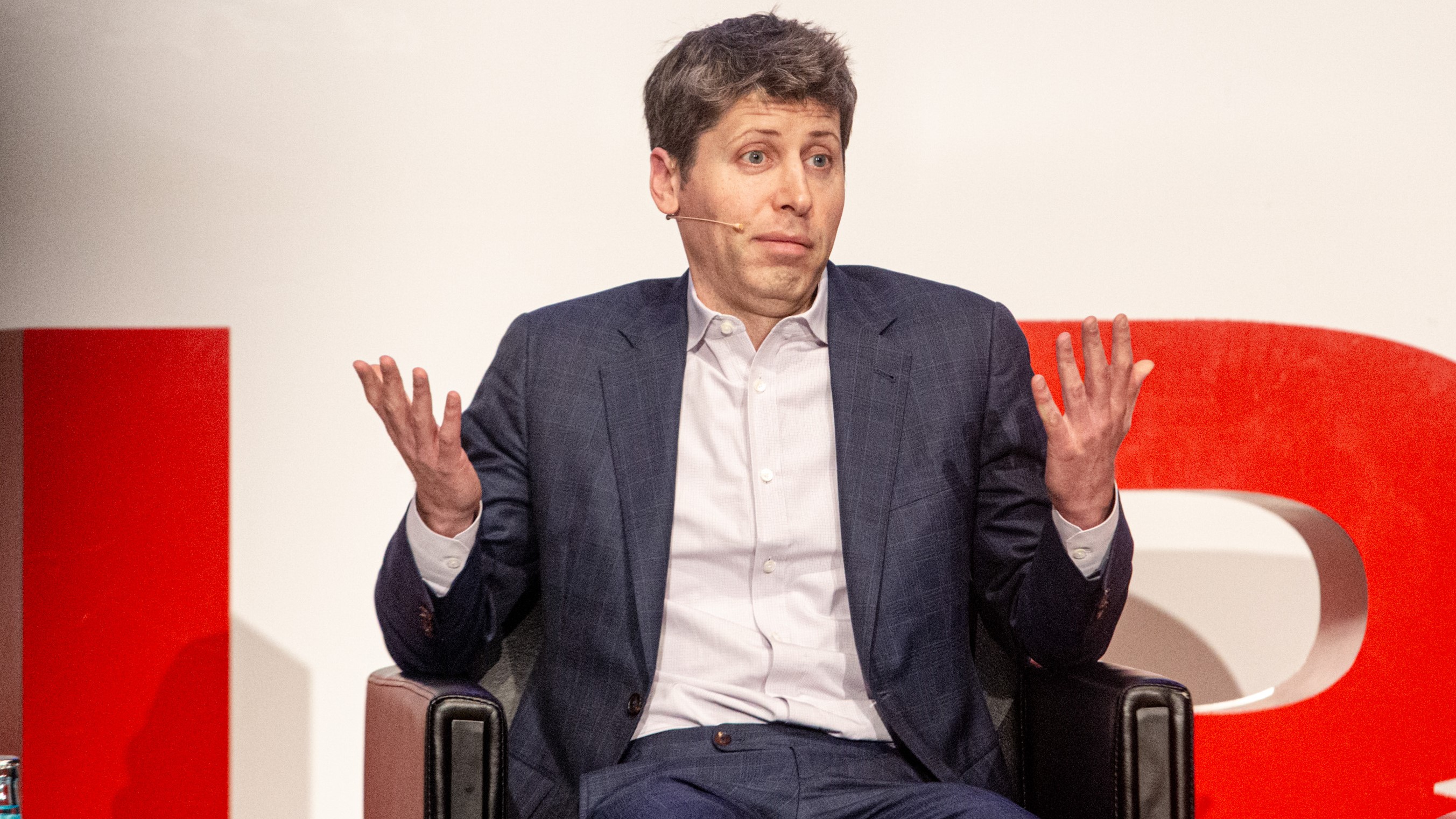 OpenAI CEO Sam Altman throws up his hands.