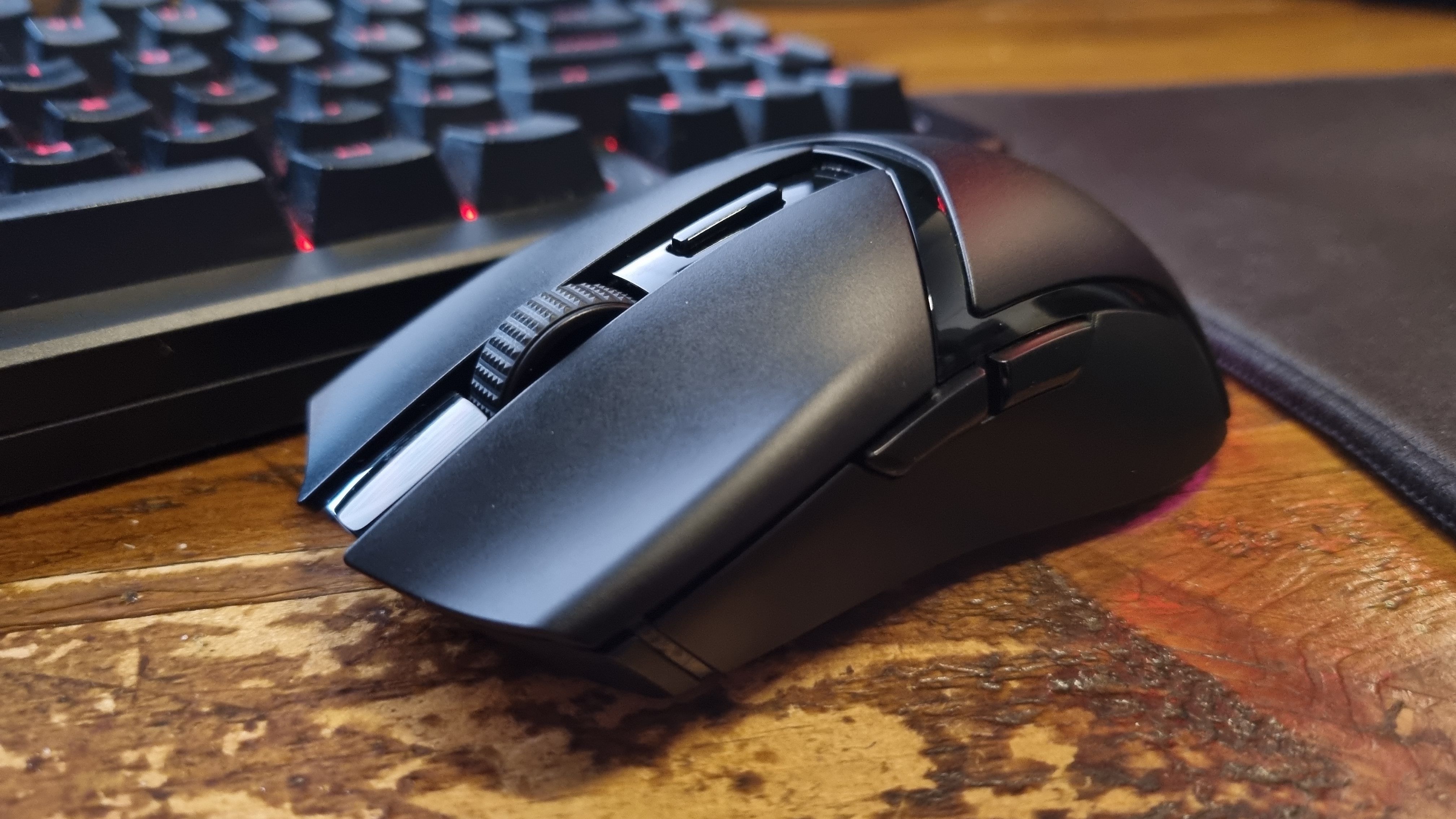 A Razer Cobra HyperSpeed gaming mouse on a desk, shot from the front