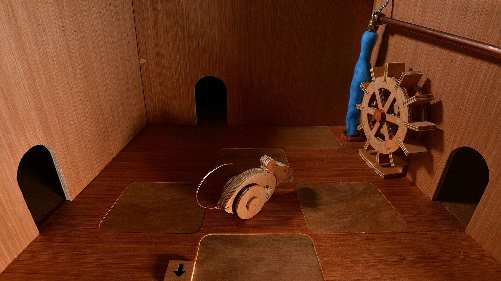 Wooden mechanical mouse examining waterwheel type deal in Ealu