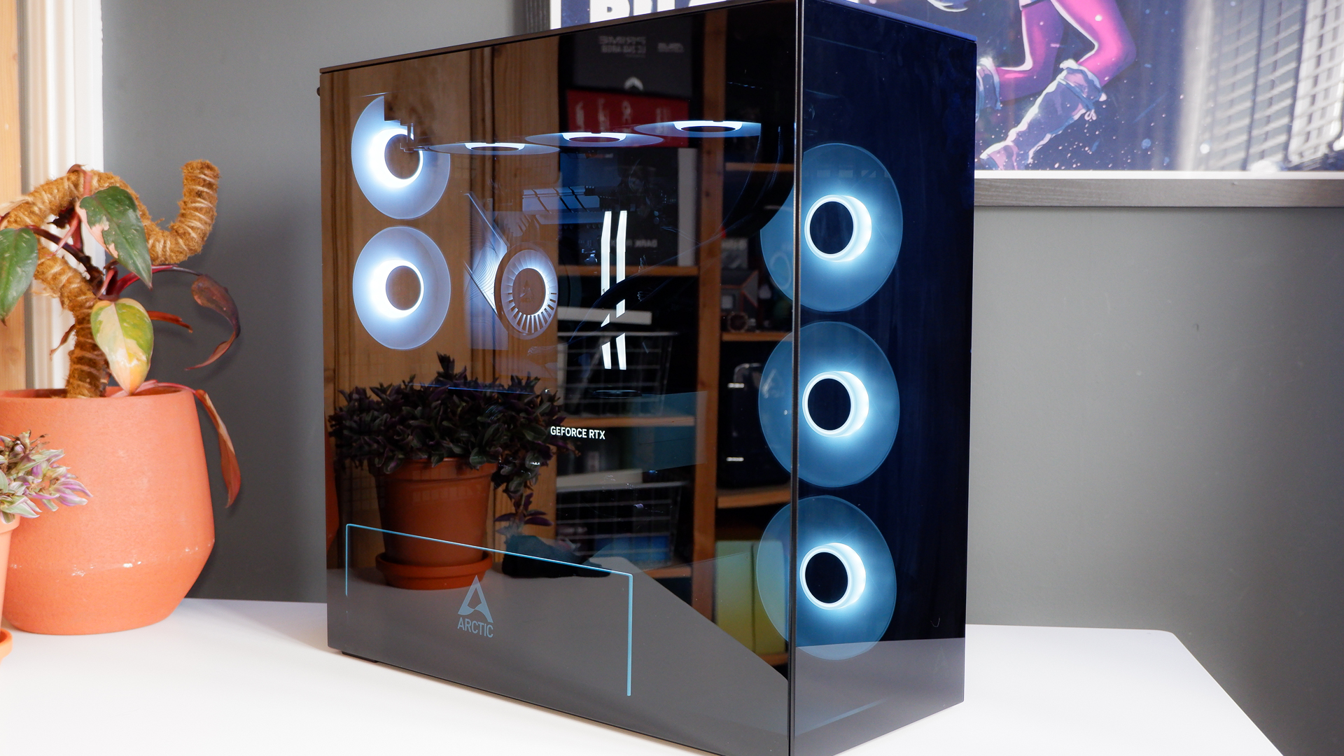 Arctic's Xtender PC case on a white desk with various parts being installed to build a functional gaming PC.