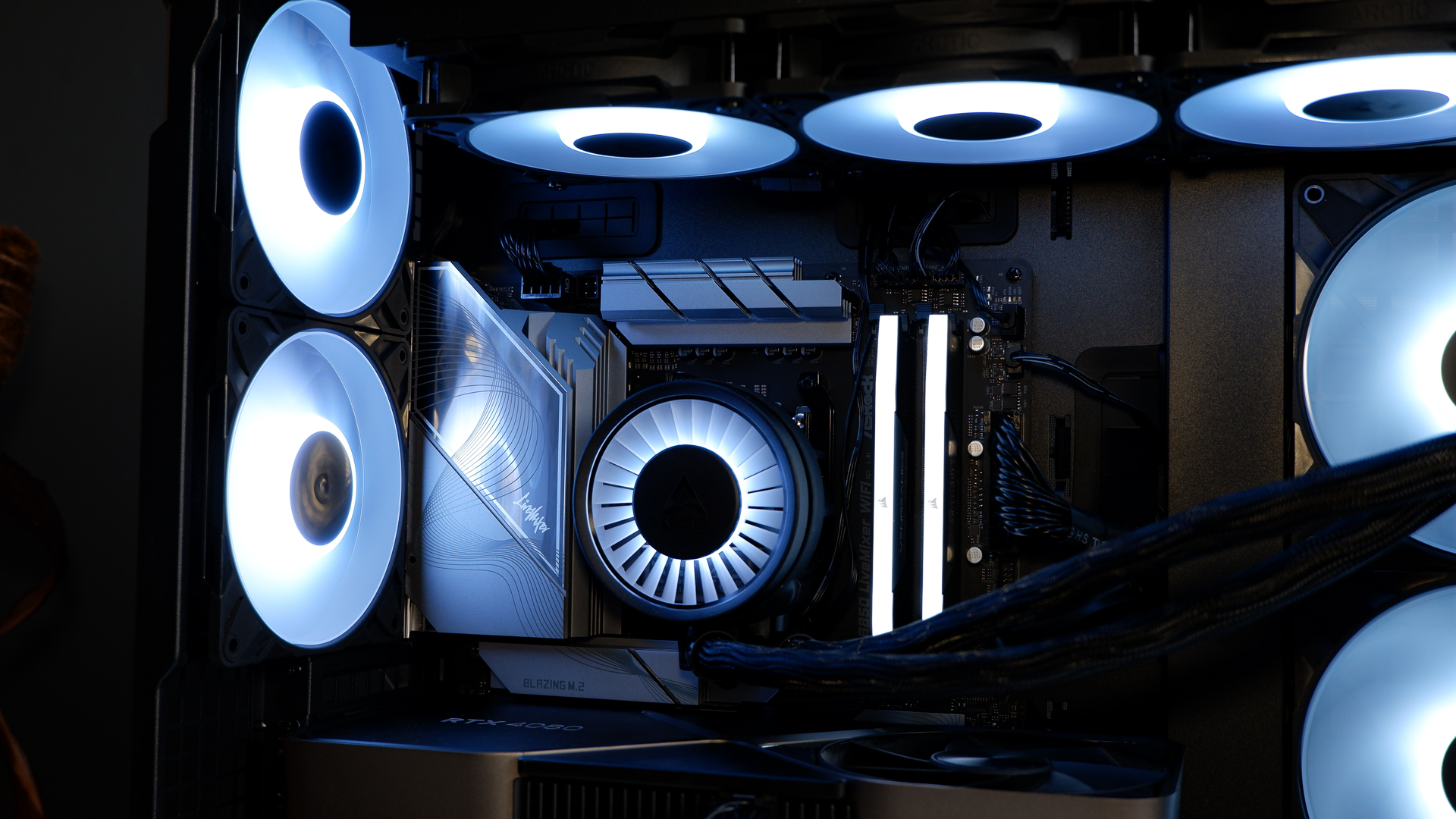 Arctic's Xtender PC case on a white desk with various parts being installed to build a functional gaming PC.