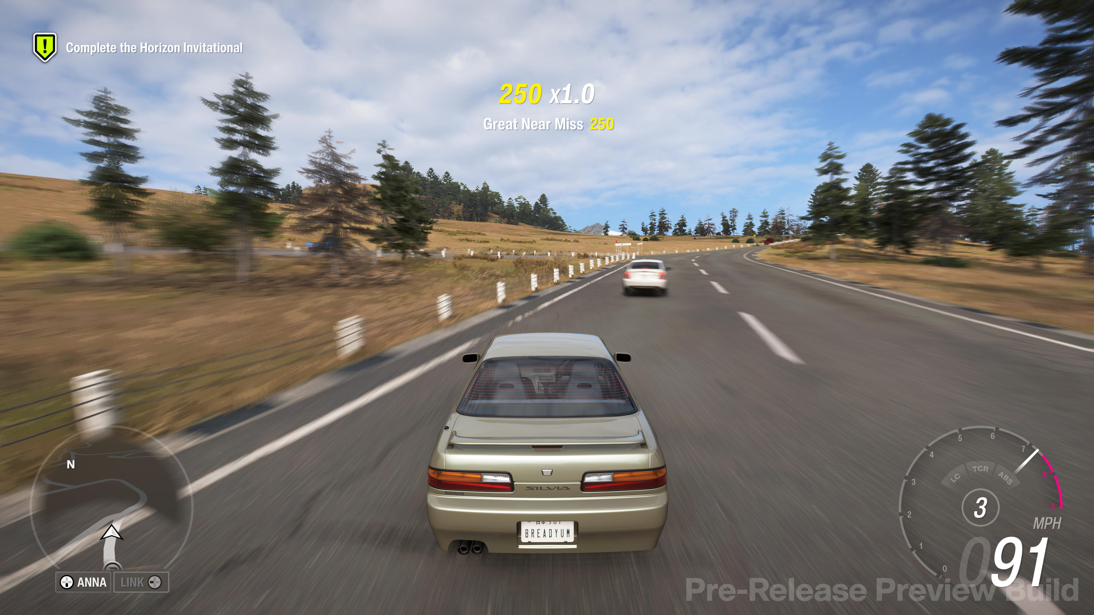 A car moving at high speed through a rural countryside