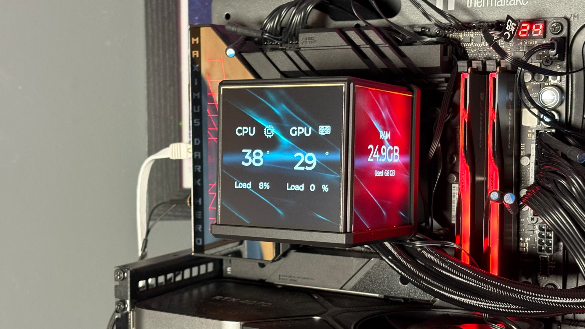 The Thermaltake Minecube 360 Ultra ARGB Sync set up on an open test bench.