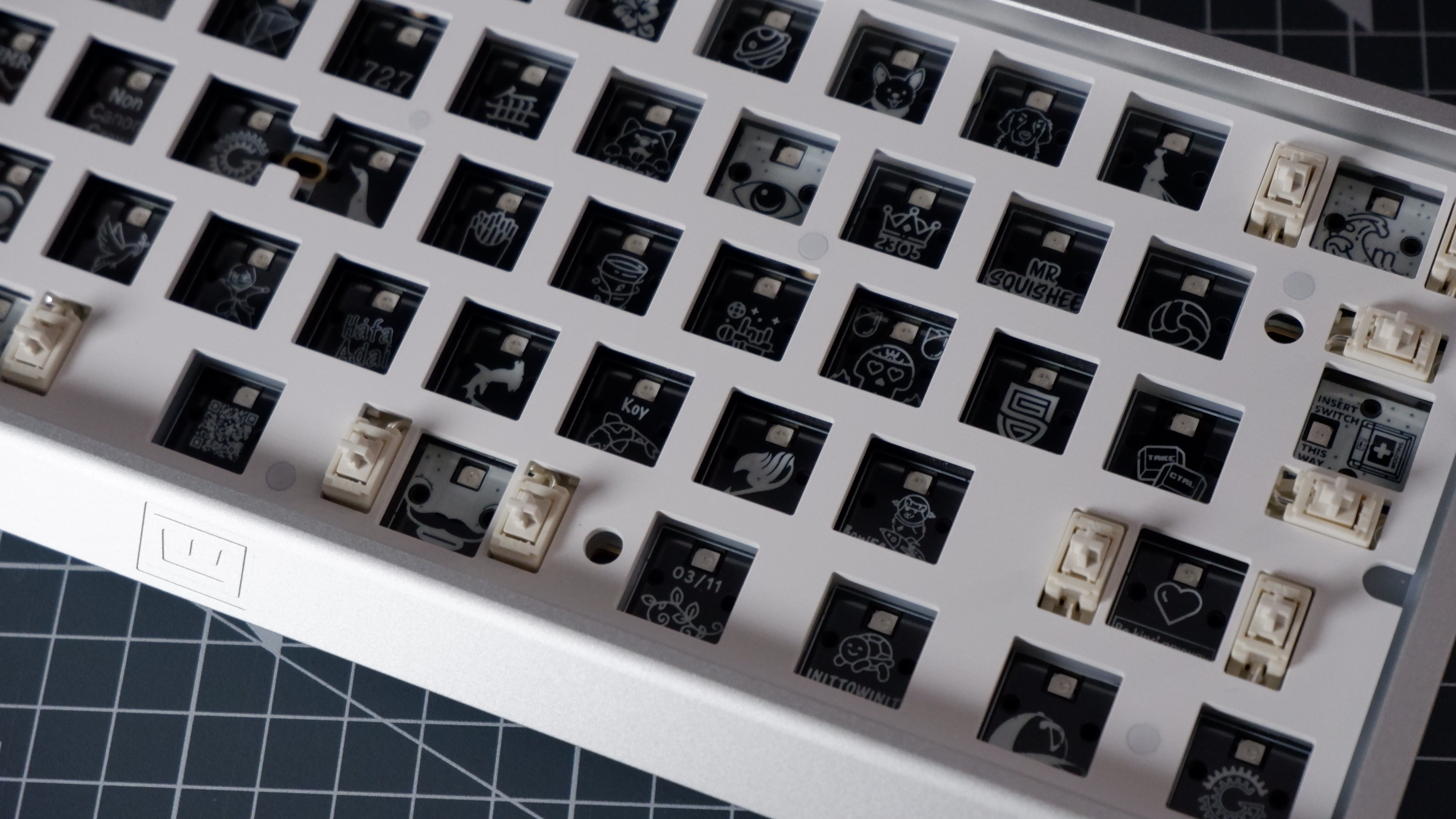 The Wooting 60HE v2 at various stages of being built.