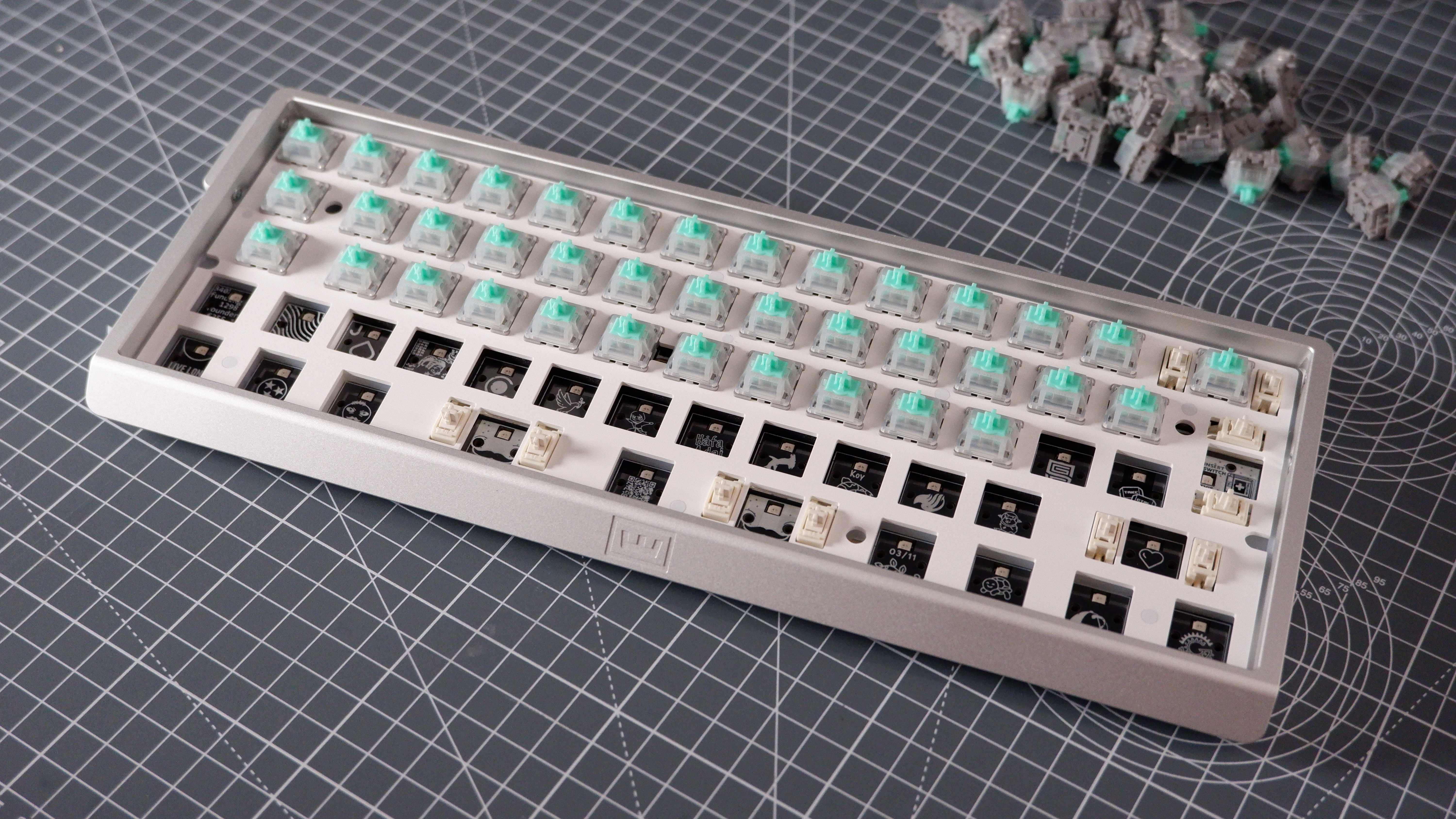 The Wooting 60HE v2 at various stages of being built.