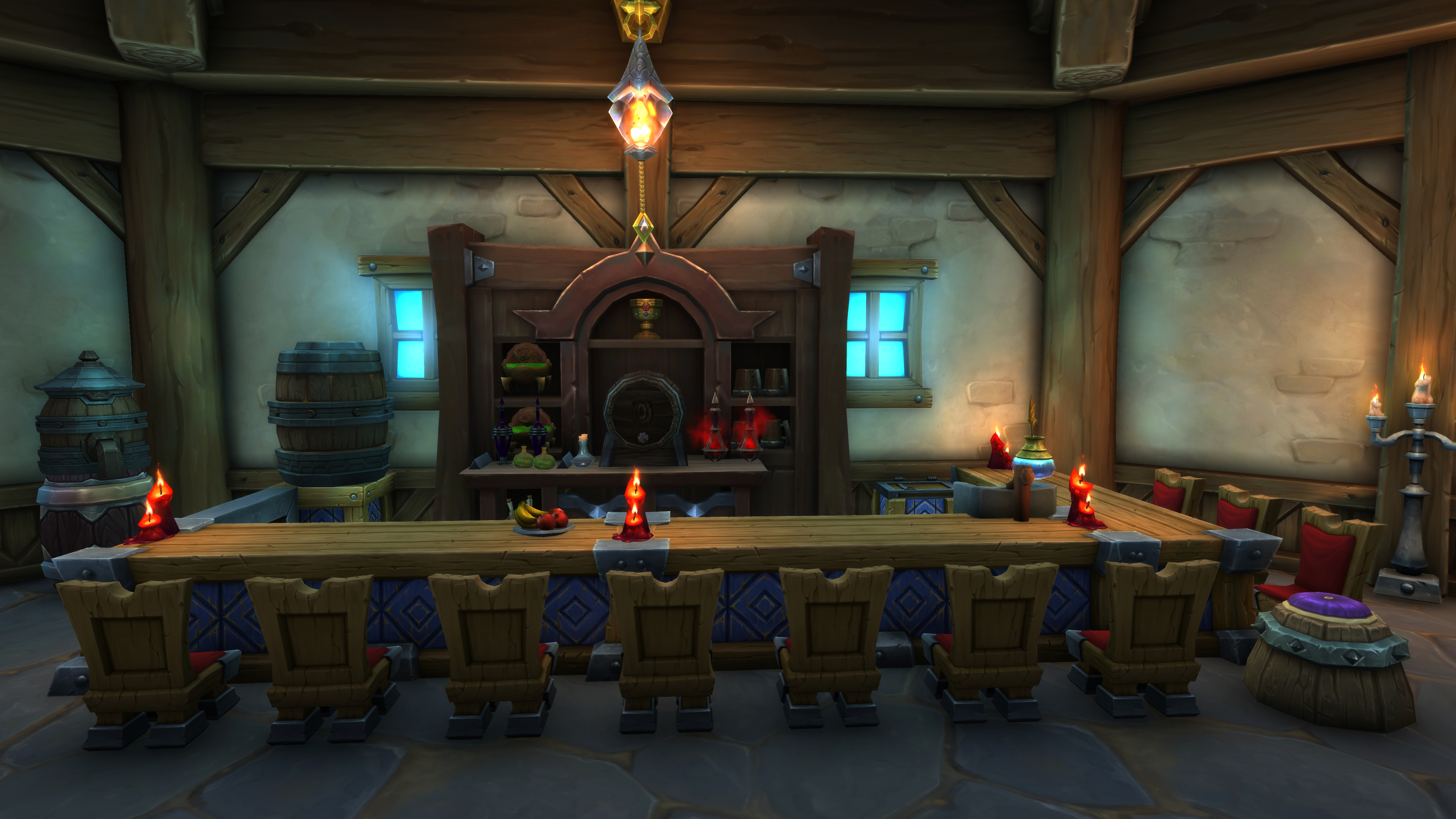 A screenshot of a World of Warcraft's player housing. Rows of chairs surround a table lit by candles inside of a cozy house.