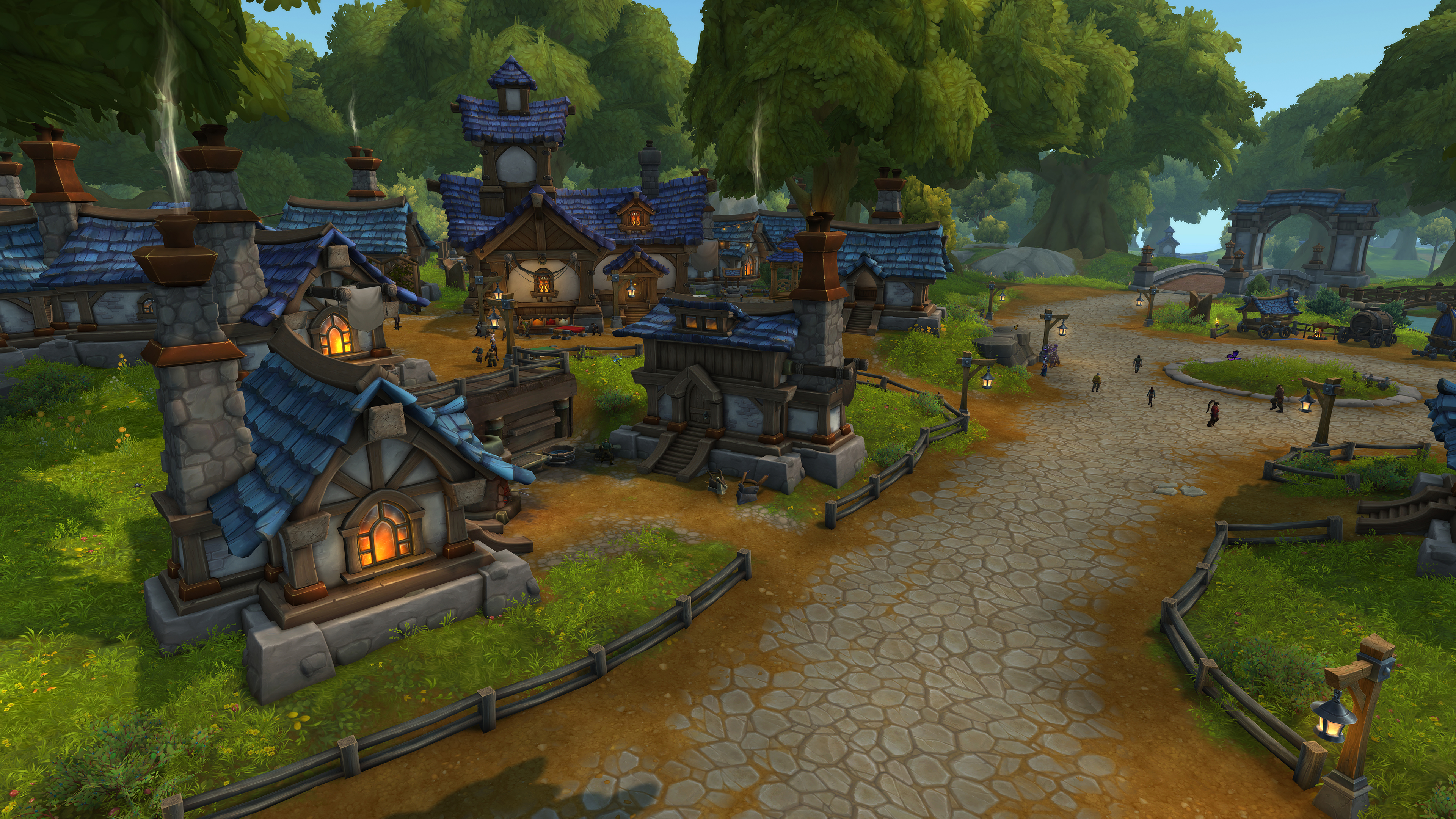 A screenshot of a World of Warcraft's player housing. A neighborhood of blue-roofed houses with a cobblestone road in front.