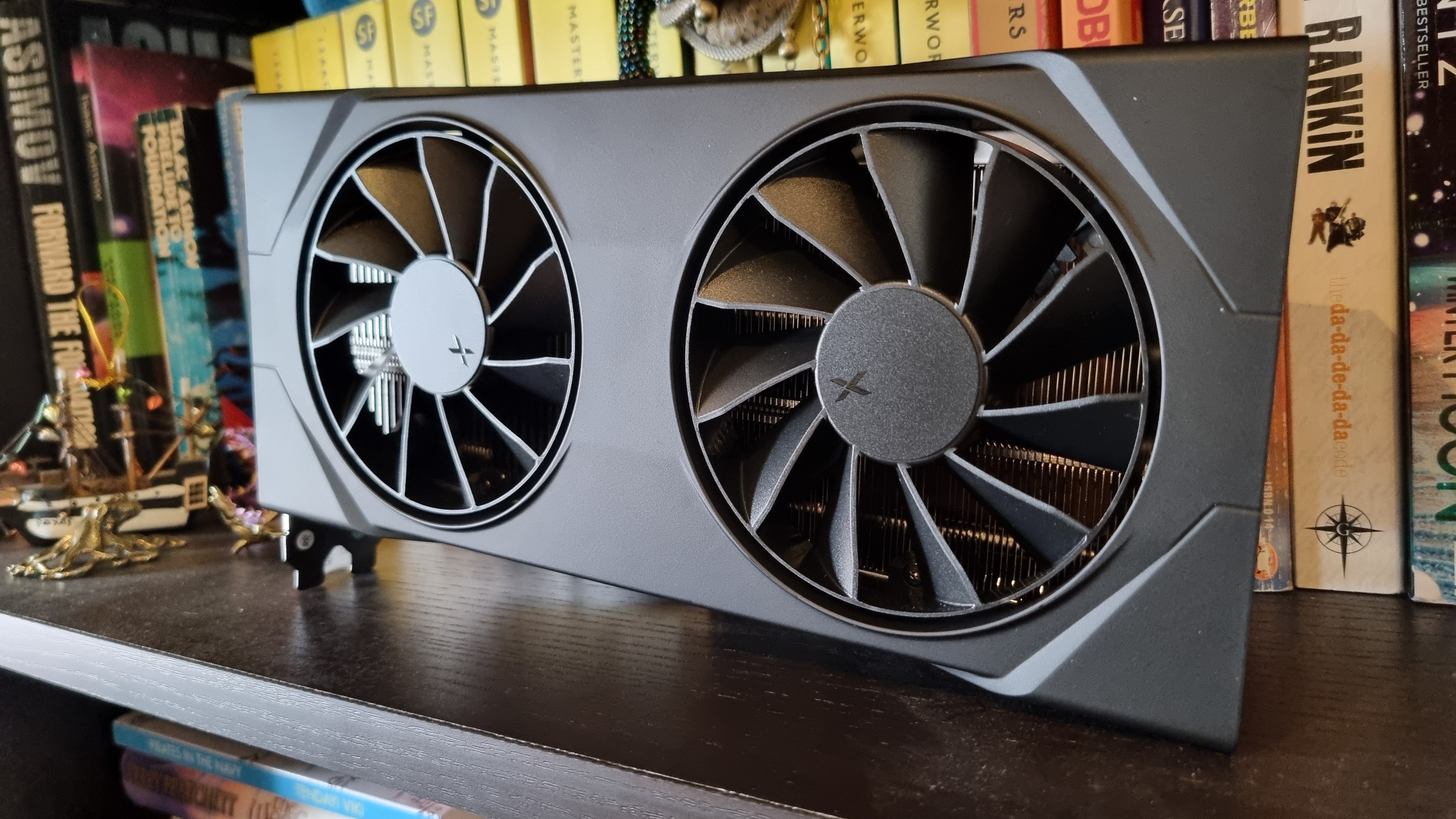 The XFX Swift AMD Radeon RX 9060 XT 16 GB on a bookshelf