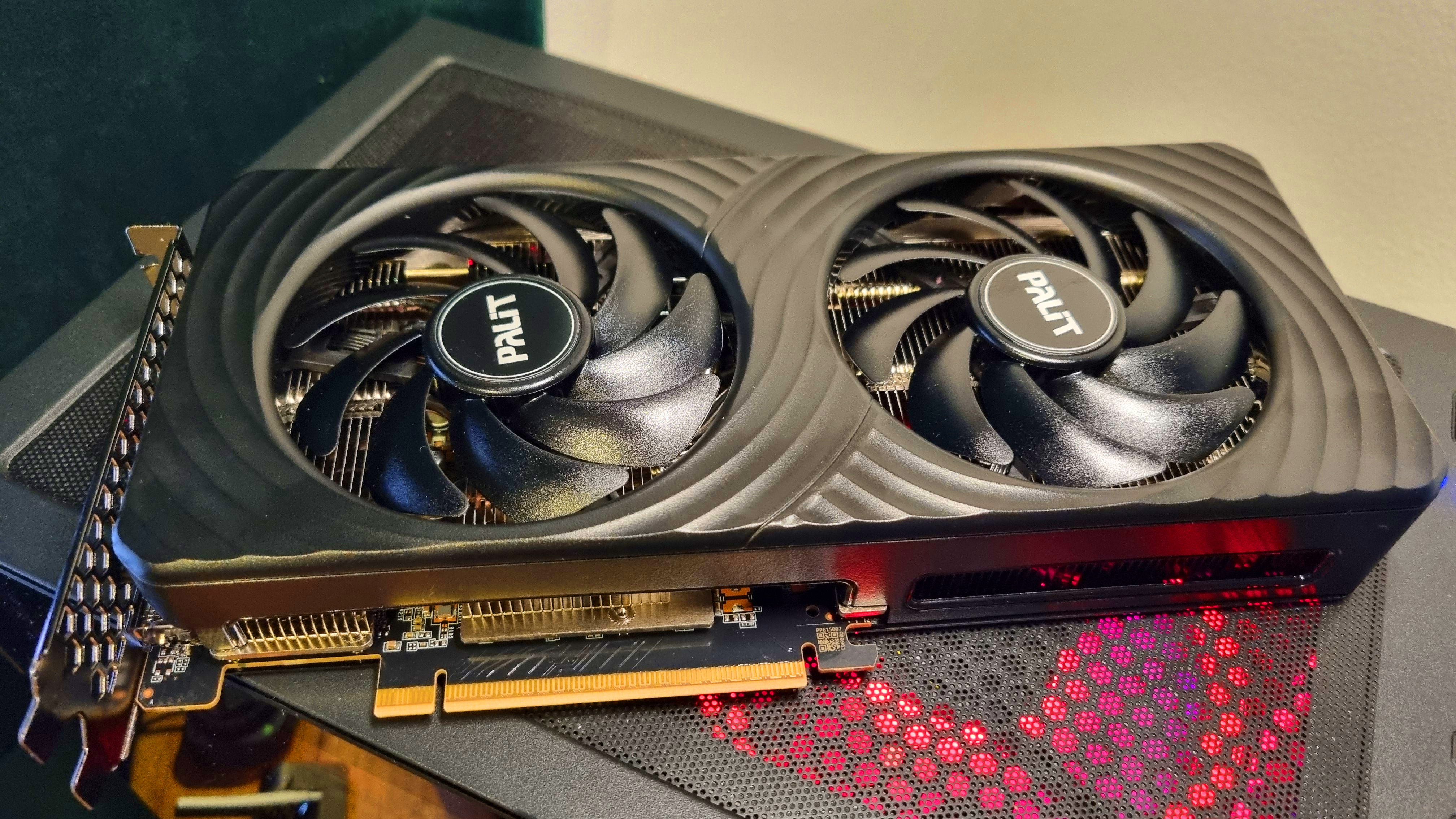 A Palit GeForce RTX 5060 Ti 8 GB Dual graphics card on top of a gaming PC