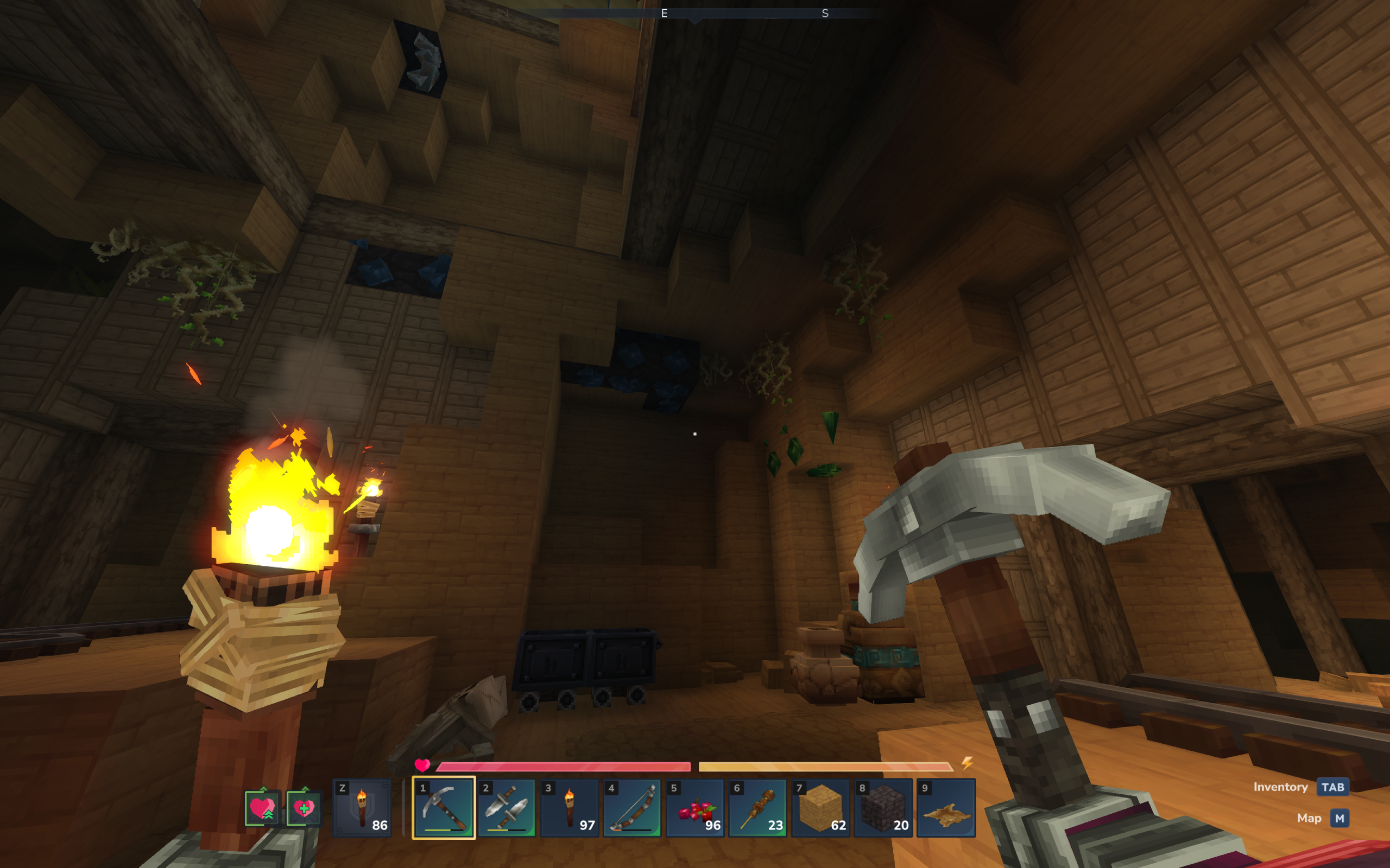 Hytale cobalt: A player looking at cobalt ore deposits in an abandoned mineshaft, holding a pickaxe and torch.