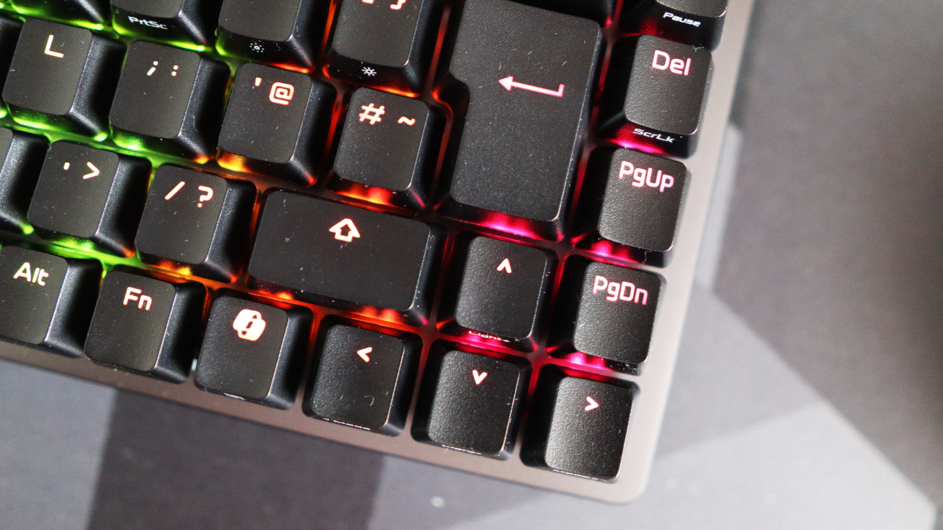 The Asus ROG Falchion Ace 75 HE on a desk with the lighting enabled.
