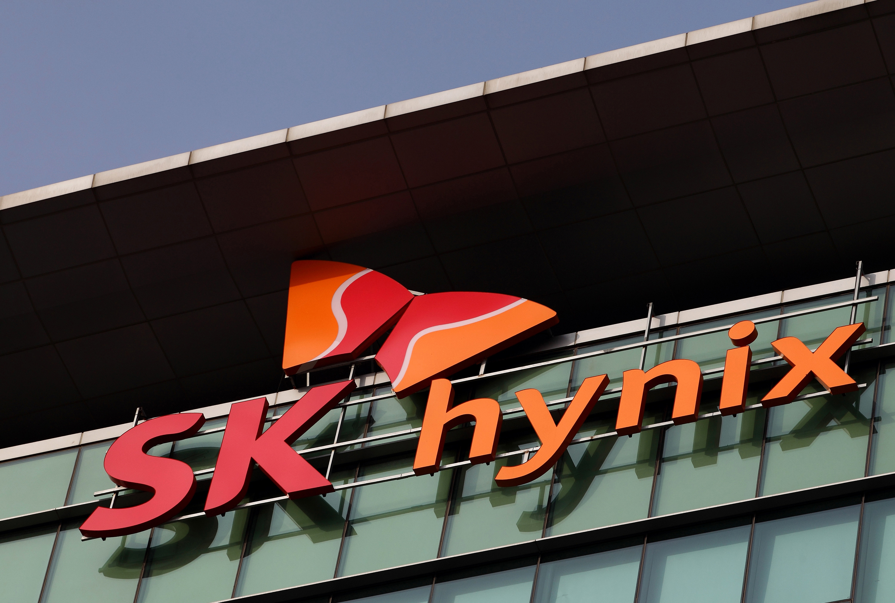 The SK Hynix Semiconductor Inc. logo is displayed at the company's plant during a media tour organized by Korea Industrial Complex Corp. (KICOX) in Cheongju, South Korea, on Friday, Nov. 23, 2012. KICOX, which develops and manages industrial complexes and support for resident enterprises as a public company under South Korea's Ministry of Knowledge Economy, held a media tour to the plant