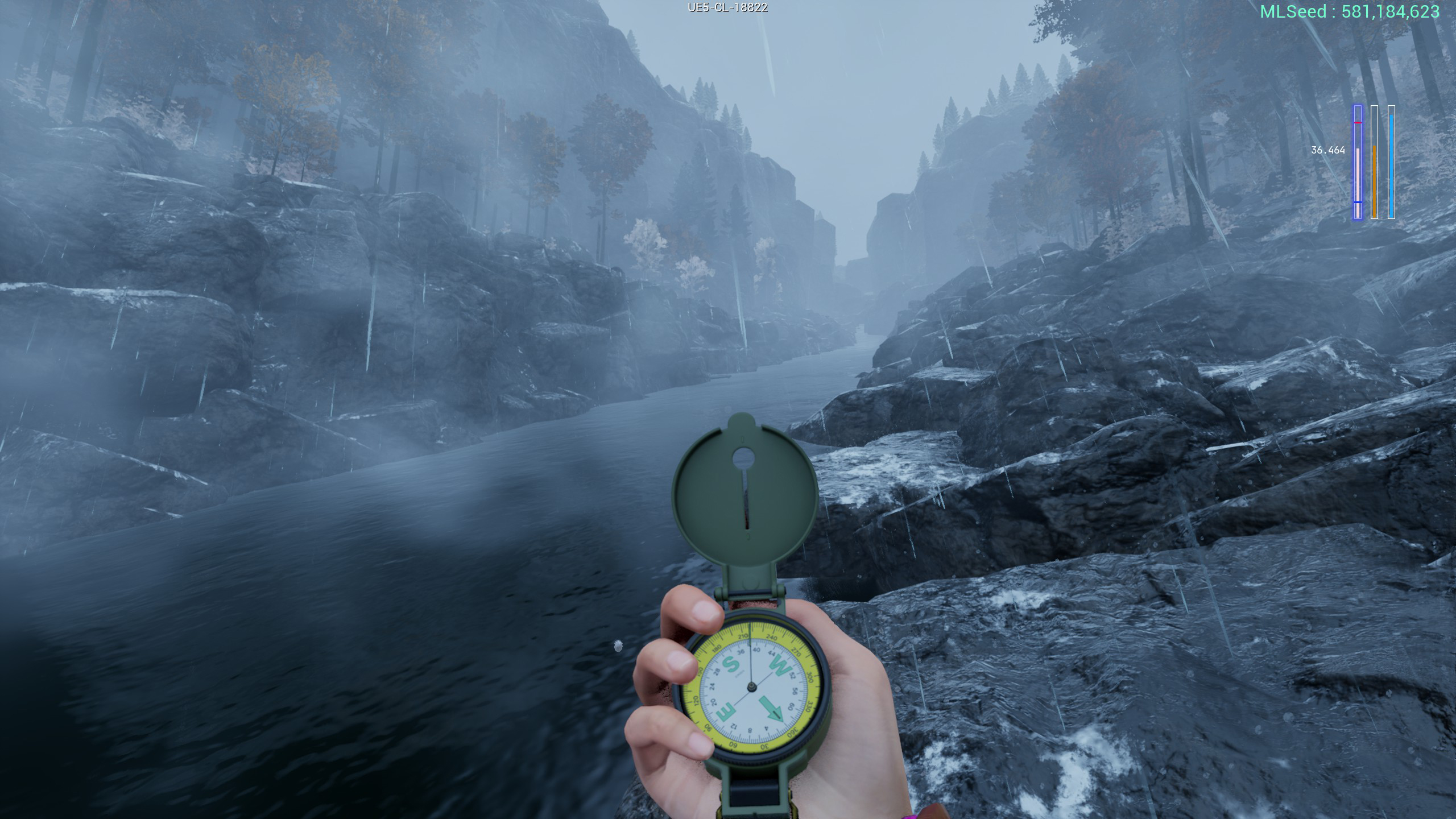 Someone holding a compass in the snow near a river