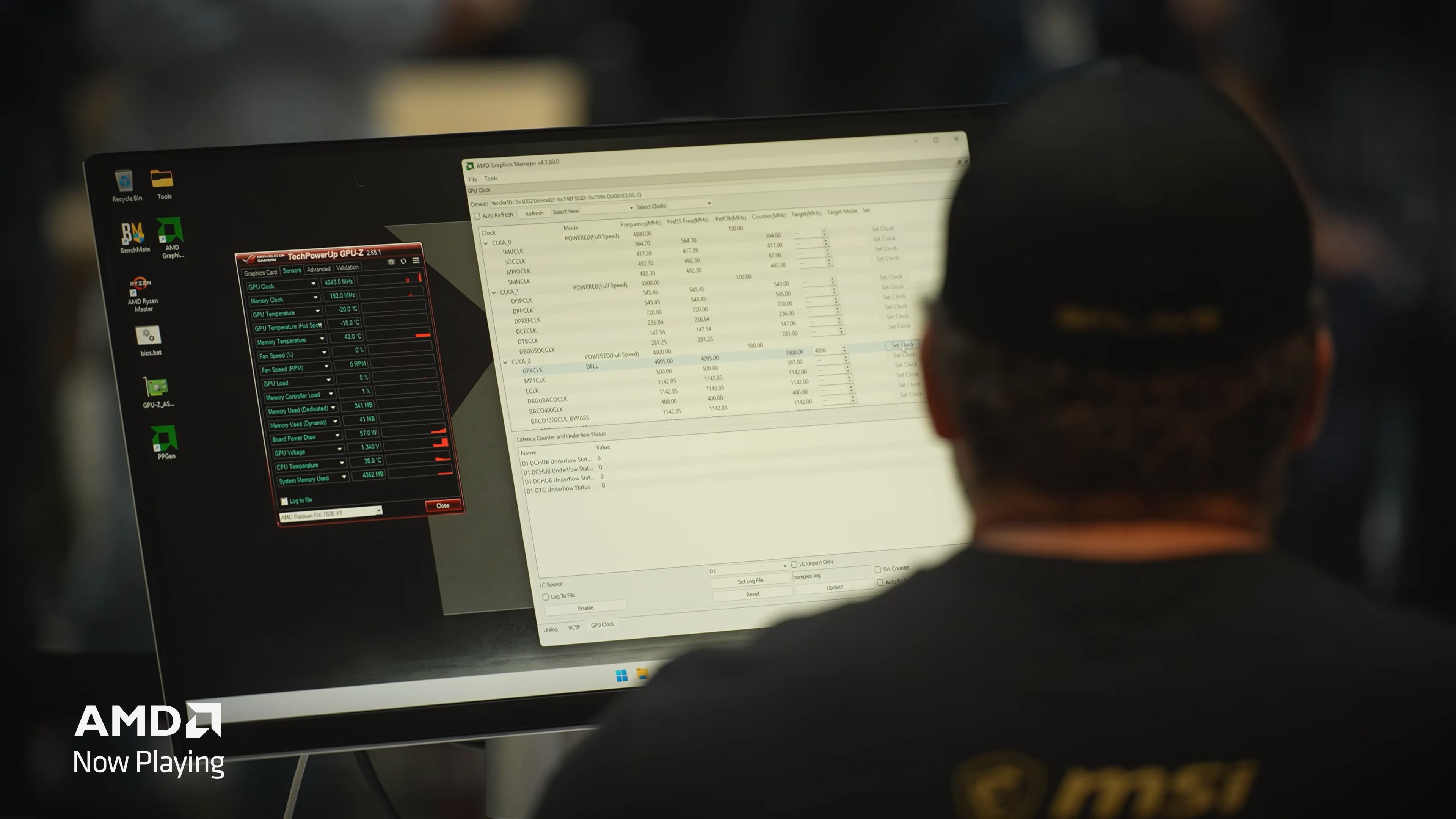 A screenshot of a YouTube video by AMD, showing top overclocker Splave looking at a monitor displaying overclocking software