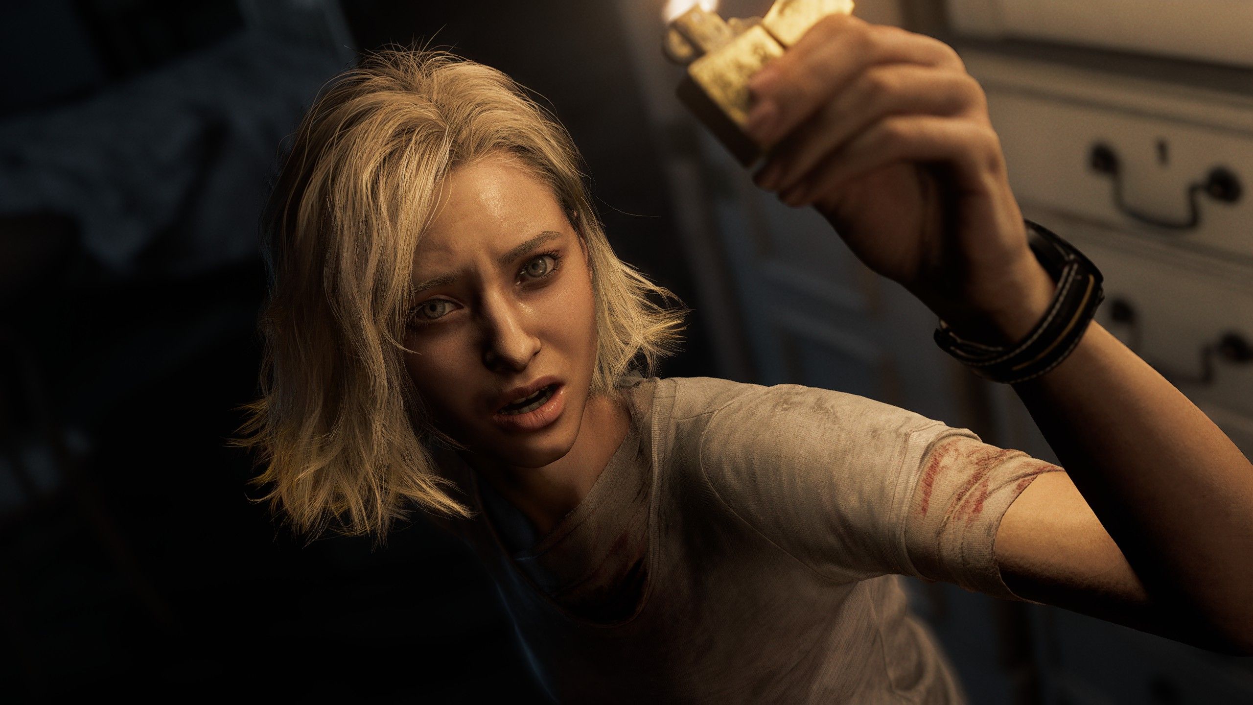 Grace holds up a lighter in the dark