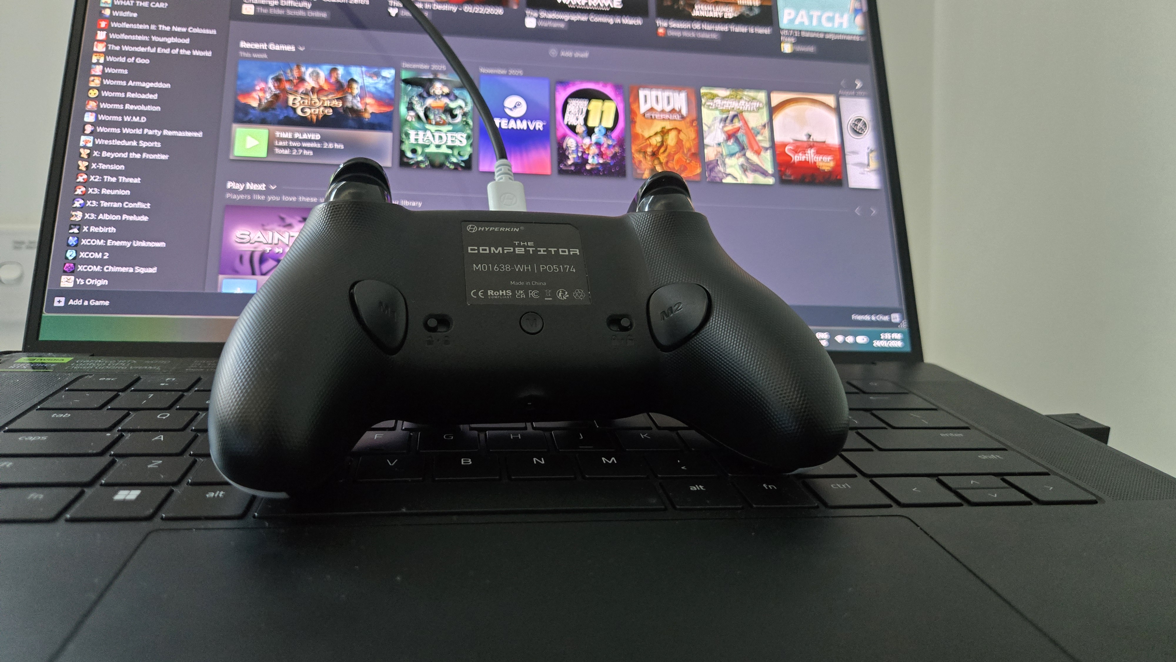 The Hyperkin Competitor on a gaming laptop.