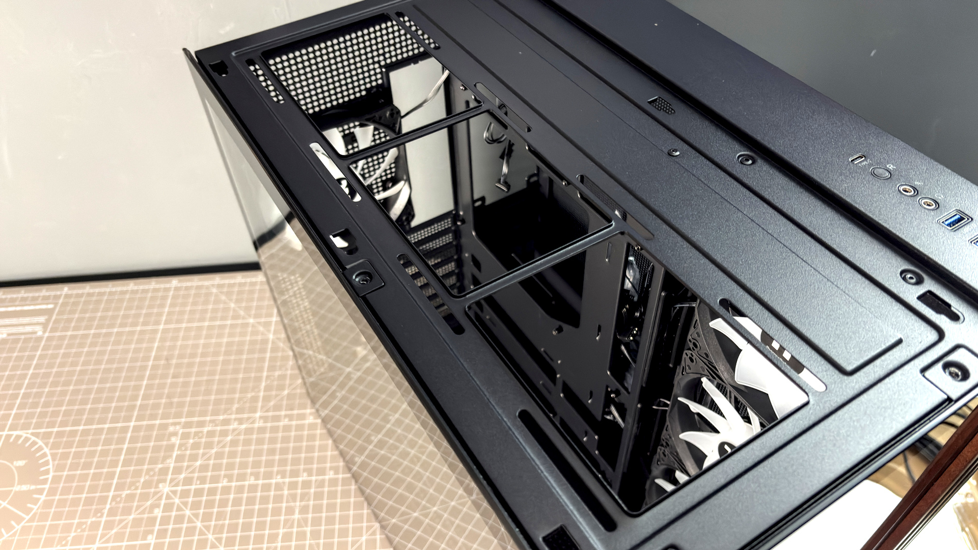 The Thermaltake View 380 WS ARGB on a desk with various components fitted.