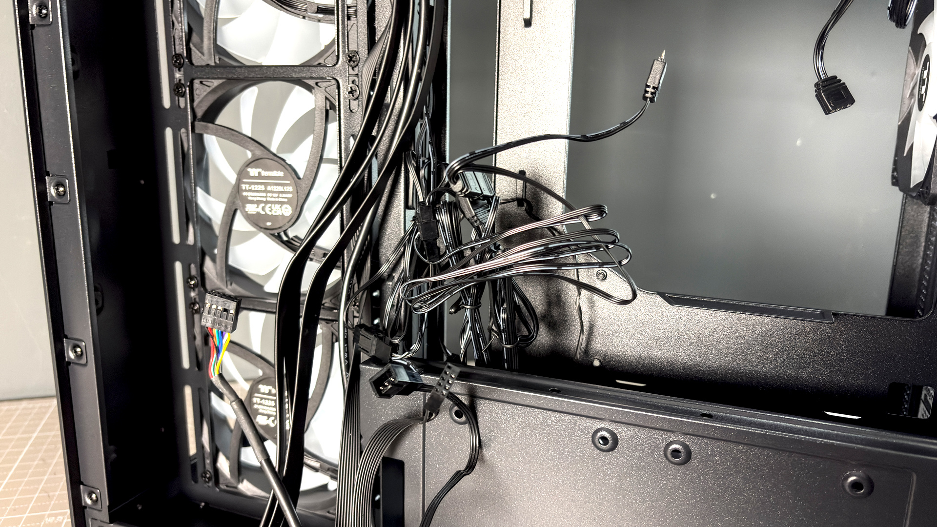 The Thermaltake View 380 WS ARGB on a desk with various components fitted.